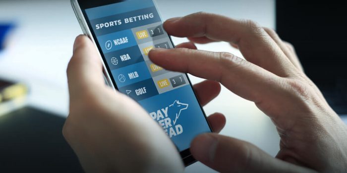Sports wagering legalization in the US- person betting on their mobile phone